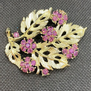 Vintage 70’s gold leaf and purple rhinestone brooch